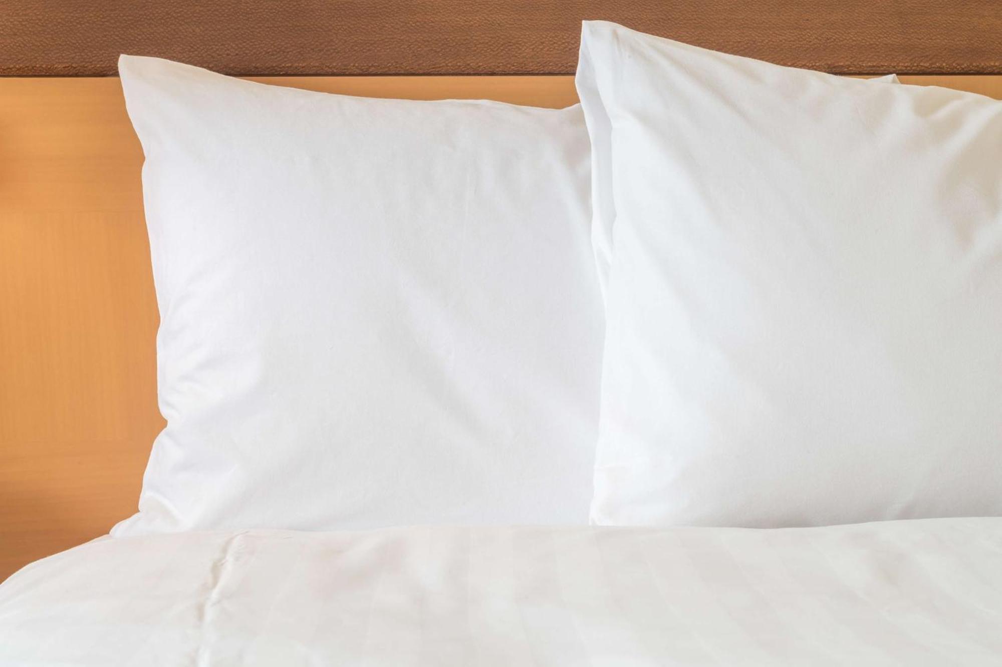 Crowne Plaza Tainan By Ihg Ξενοδοχείο Εξωτερικό φωτογραφία Two pillows on a bed